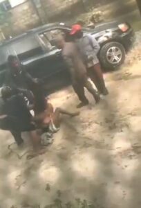 Boobs Out As Nigerian Police Strip Woman With Big Breasts Naked In Public (18+)