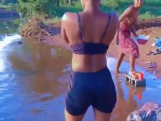 African Girl Showing Breasts In A River In Public (18+)